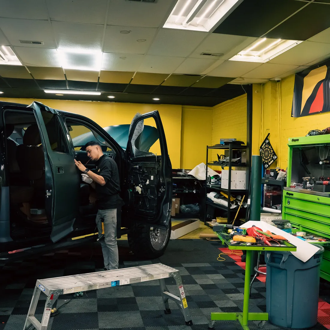 Lifted truck in the Black Optix Tint bay